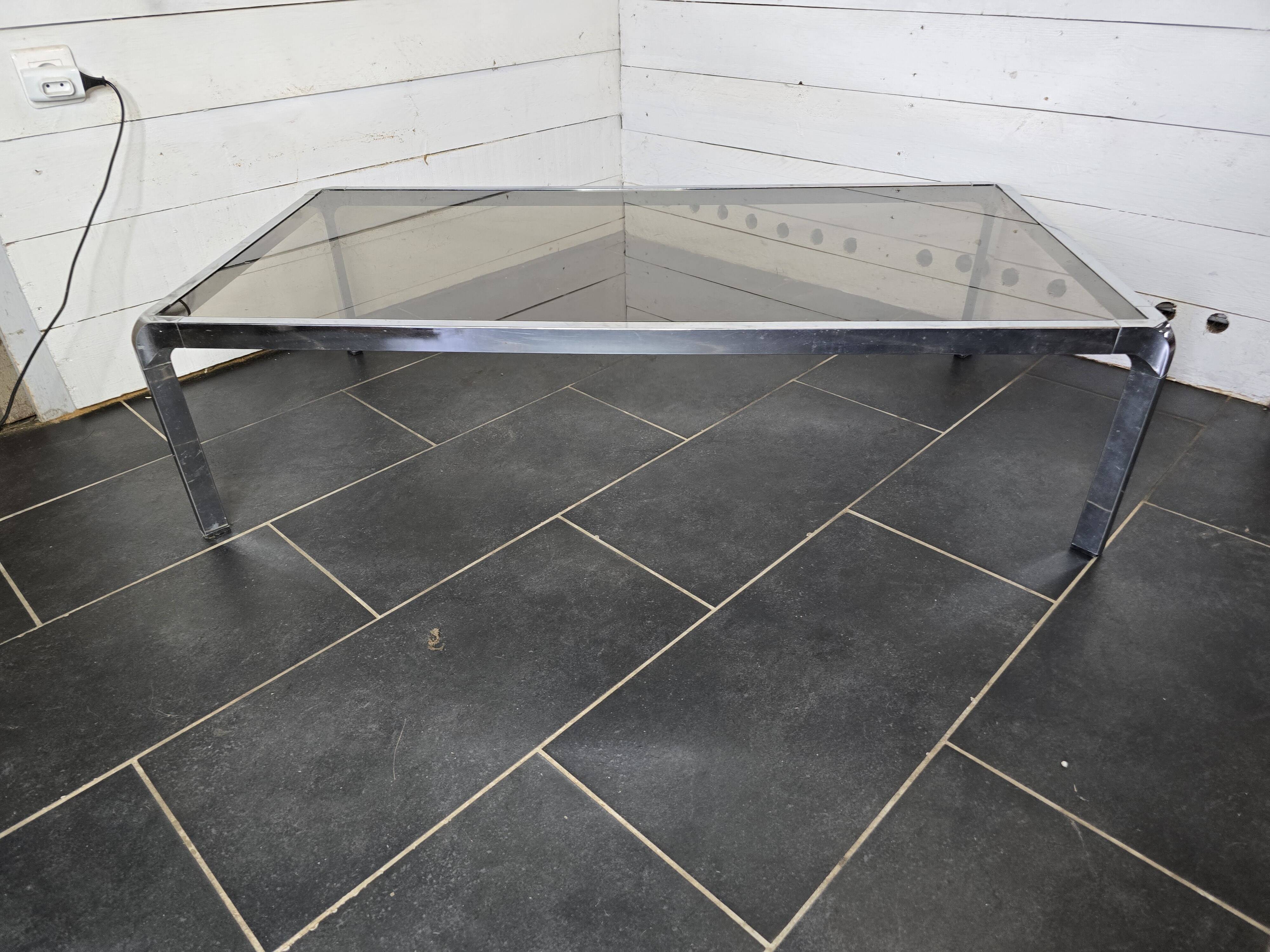 Chromed metal coffee table with smoked glass top from the 70s
