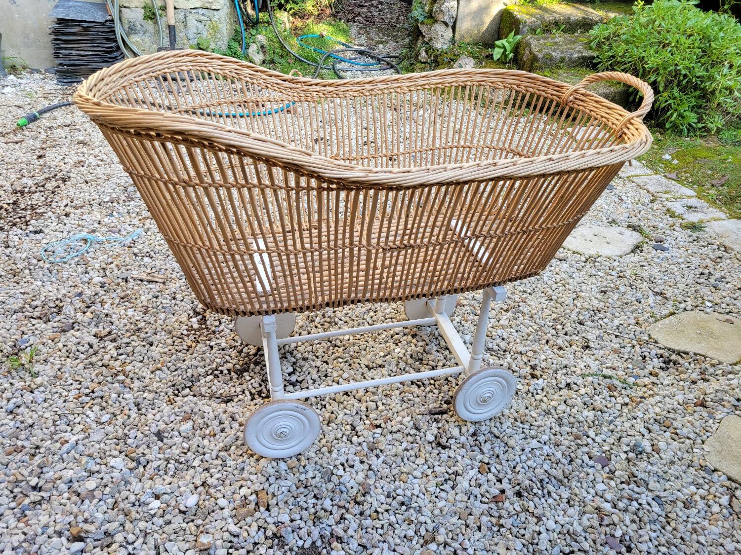 Wicker cradle on wheels, late 19th century