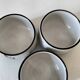 Three glazed ceramic bowls with raised graphic decoration, 1970s.