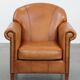Fauteuil en cuir de vachette couleur cognac