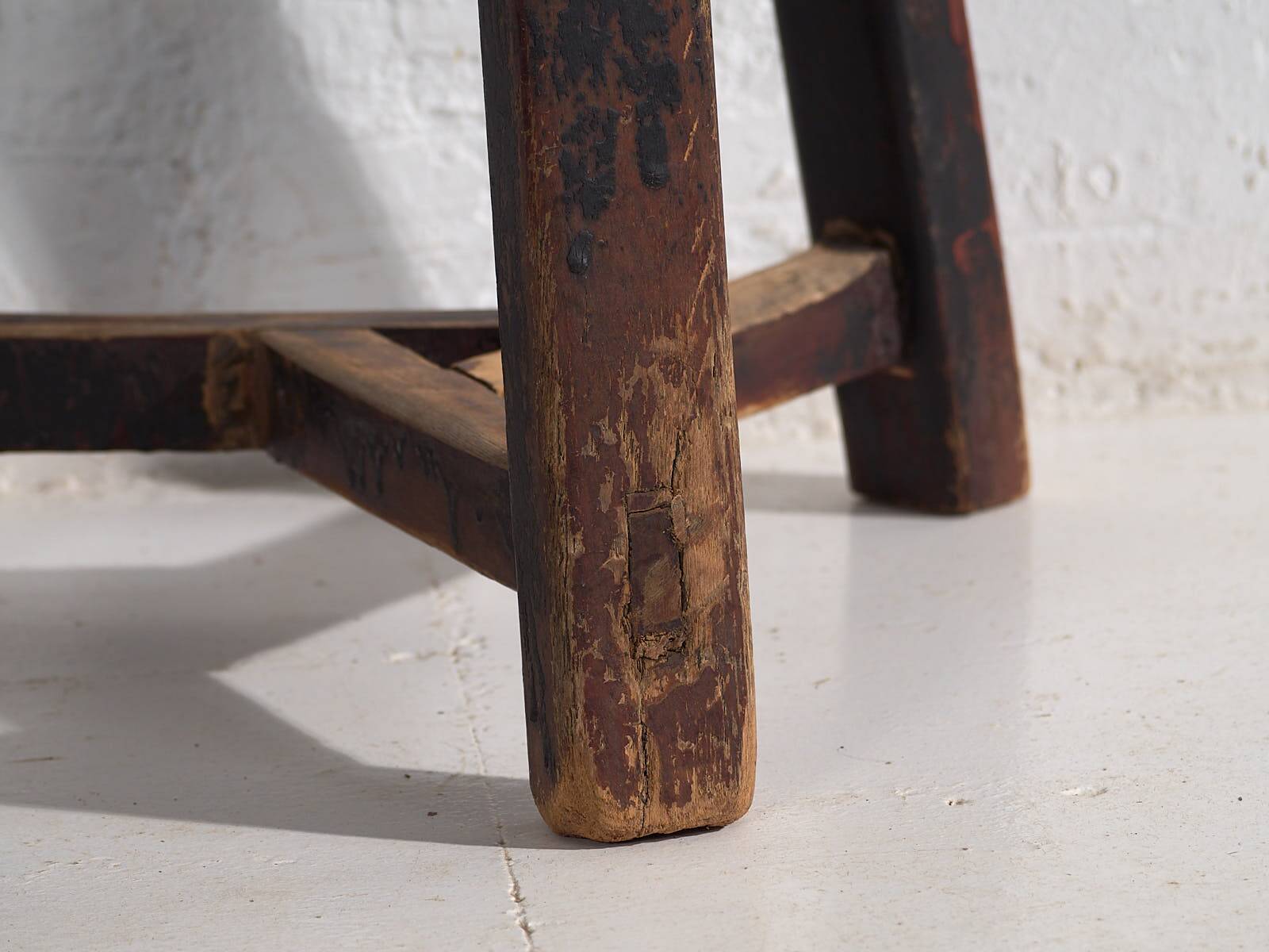 Antique round dark colored stool (c.1900)