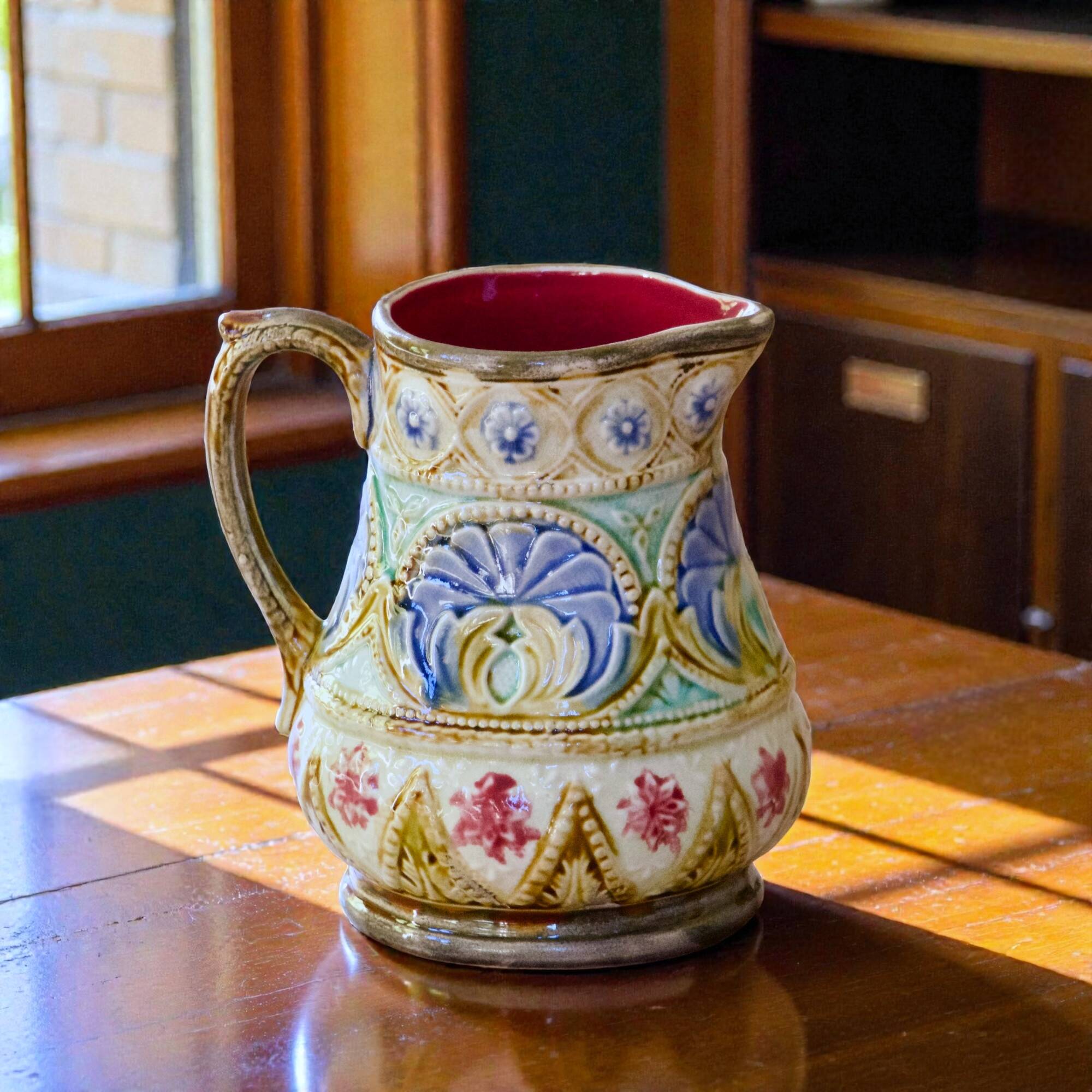 19th-century antique pitcher in polychrome majolica signed Nimy-les-Mons.