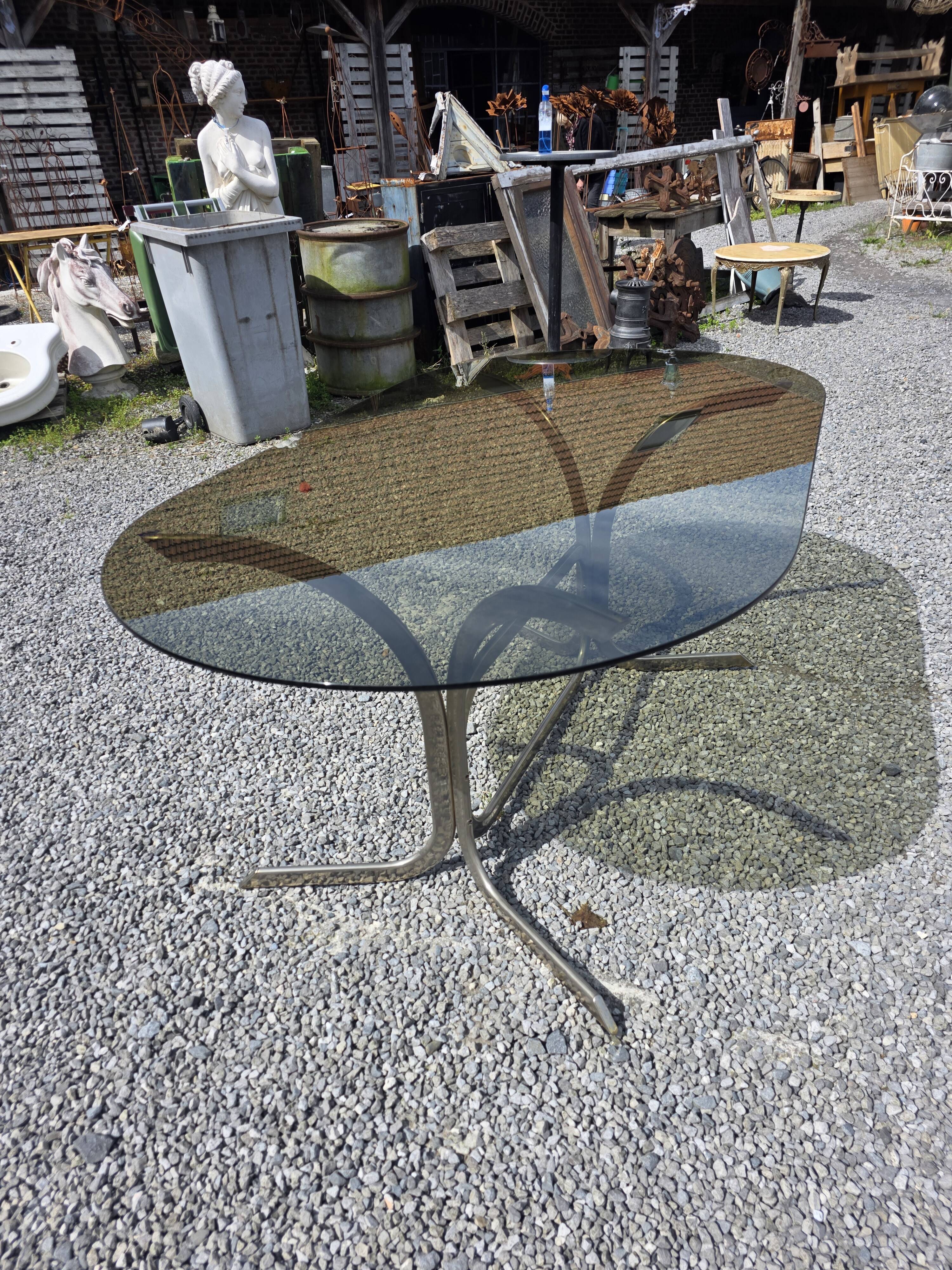 Silver metal table with smoked glass top from the 1970s.