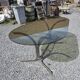 Silver metal table with smoked glass top from the 1970s.