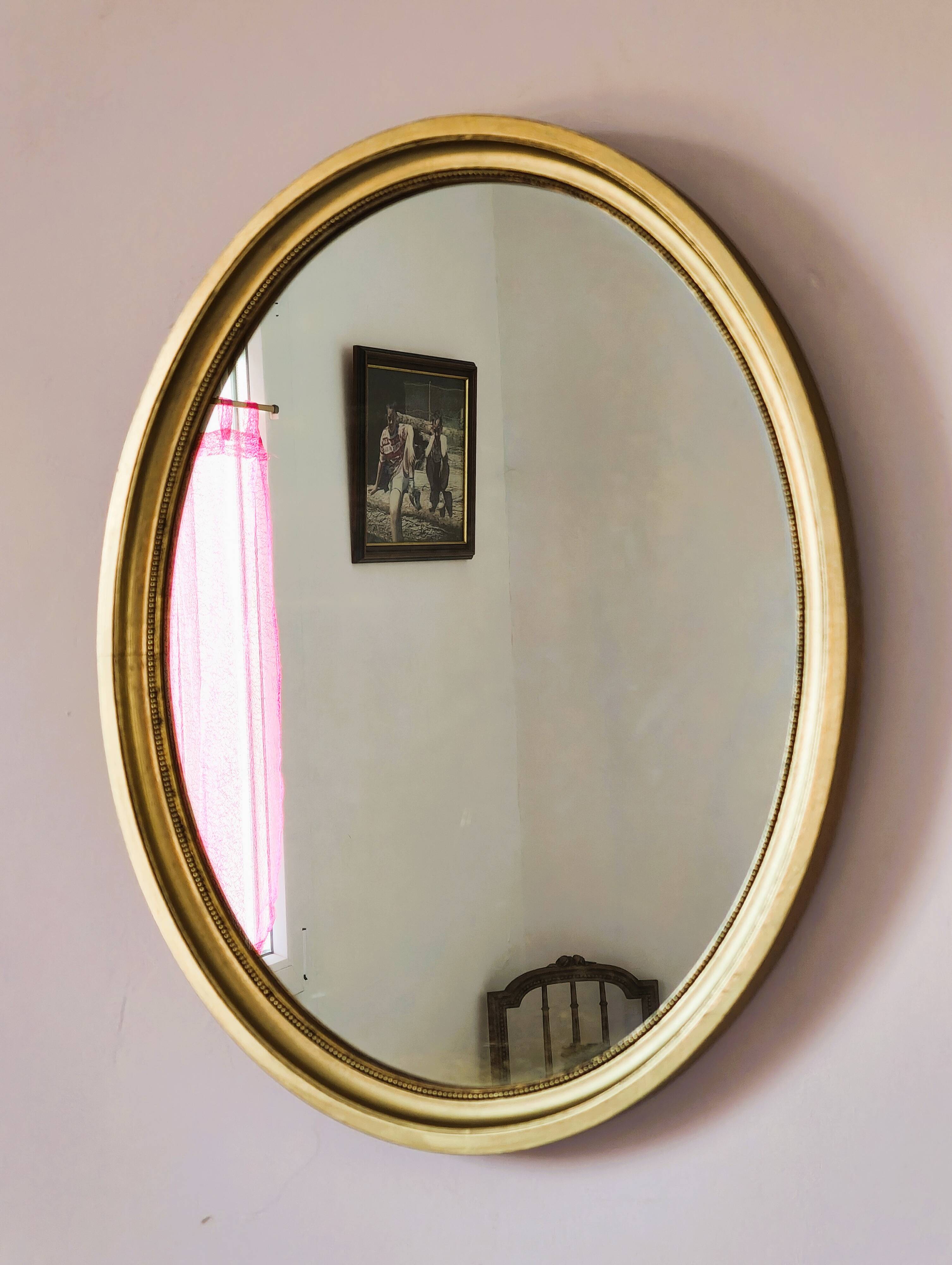 Antique gold oval mirror