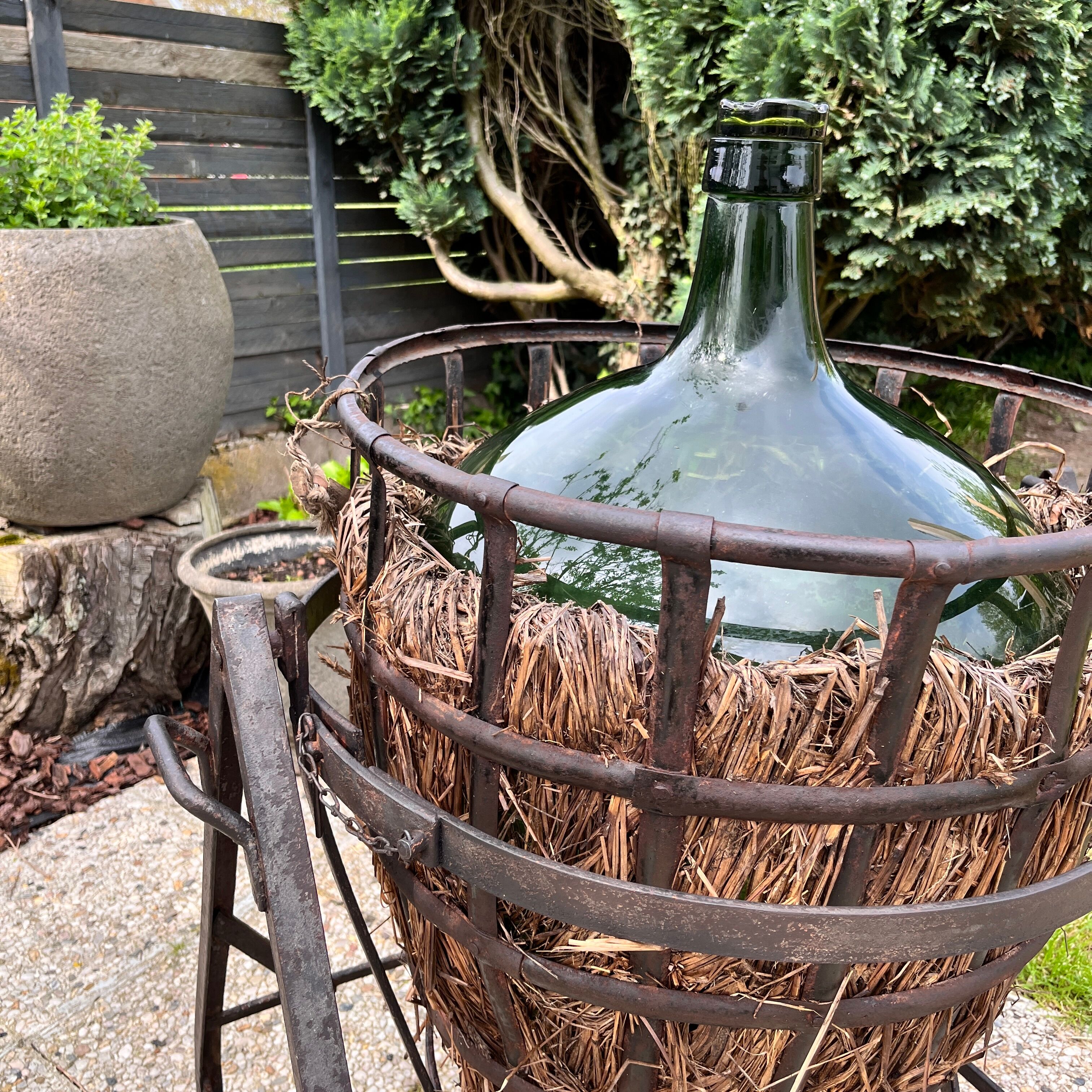 Demijohn on steel rocker