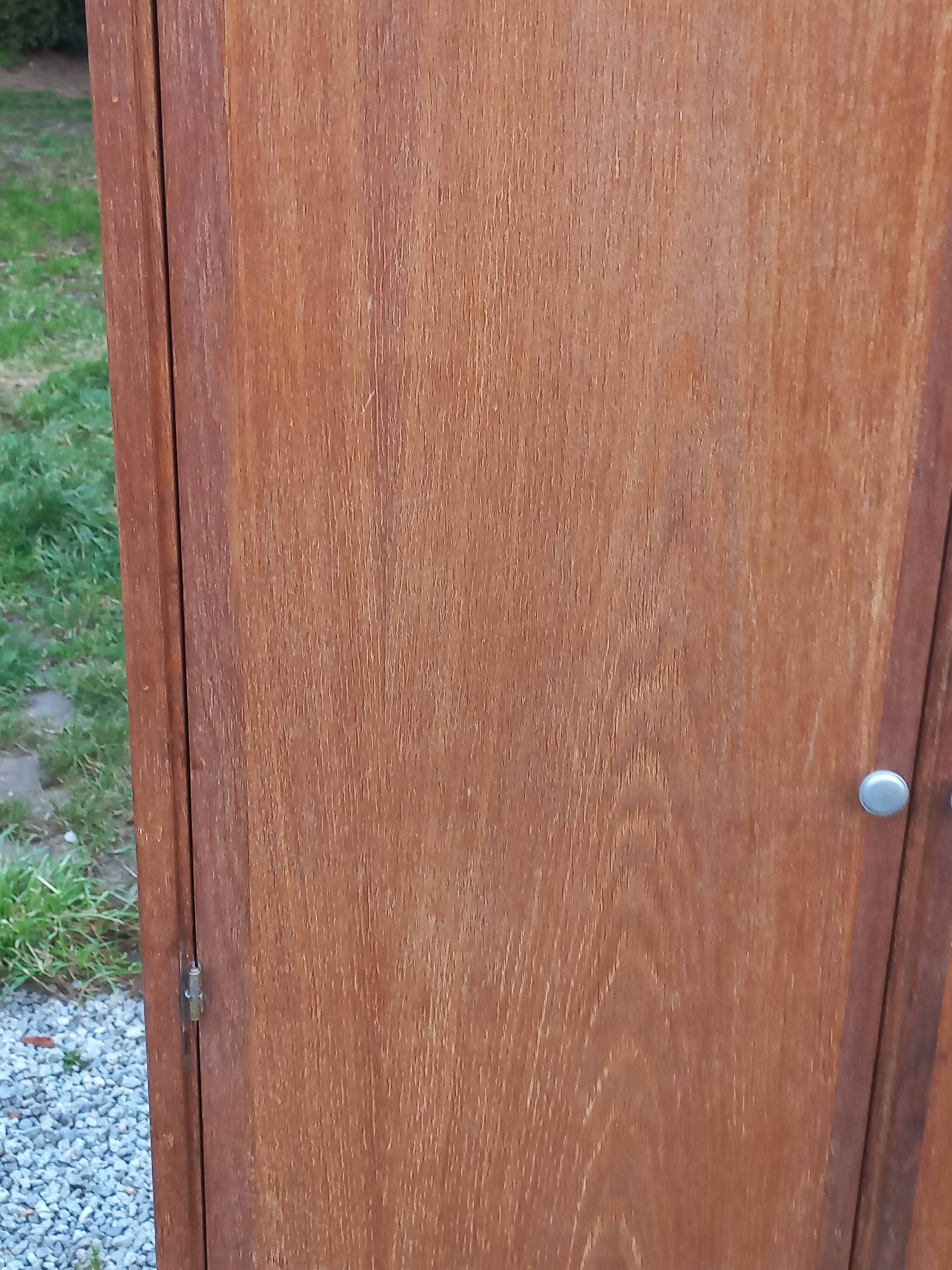 Vintage oak wardrobe with metal legs from the 1950s.