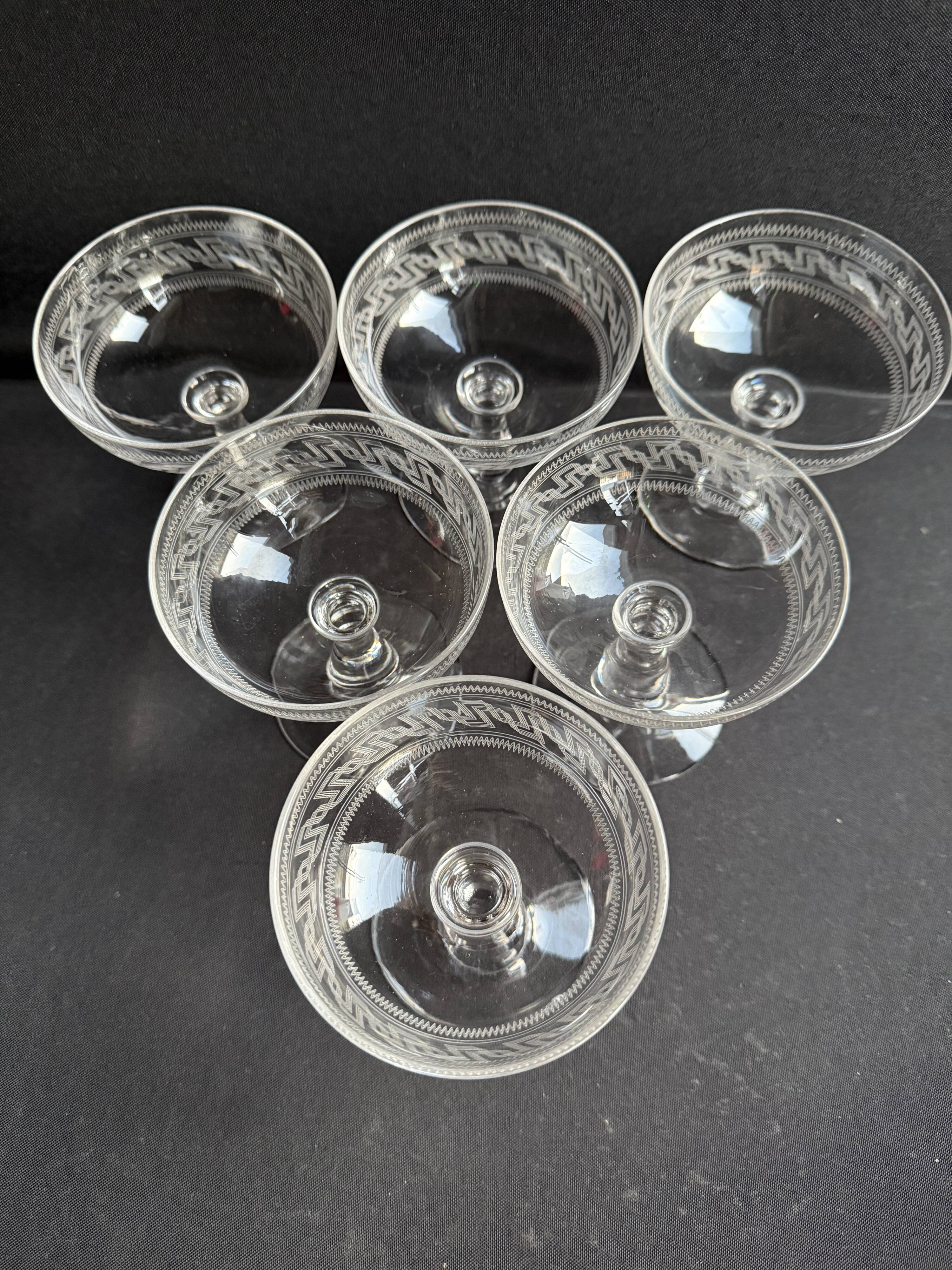 6 Baccarat champagne coupes with Greek engraving, slanted.