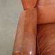 Light cognac-coloured cow leather wingback armchair with matching piping