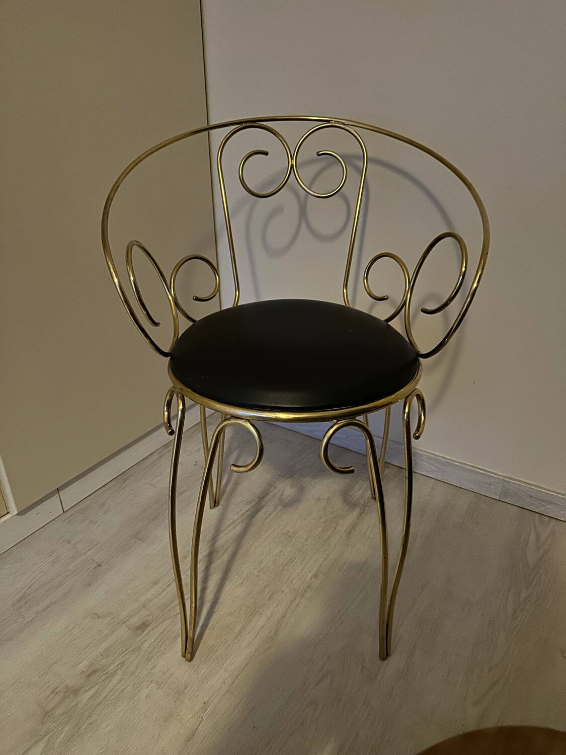 1960s brass and vinyl scroll chair