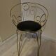 1960s brass and vinyl scroll chair