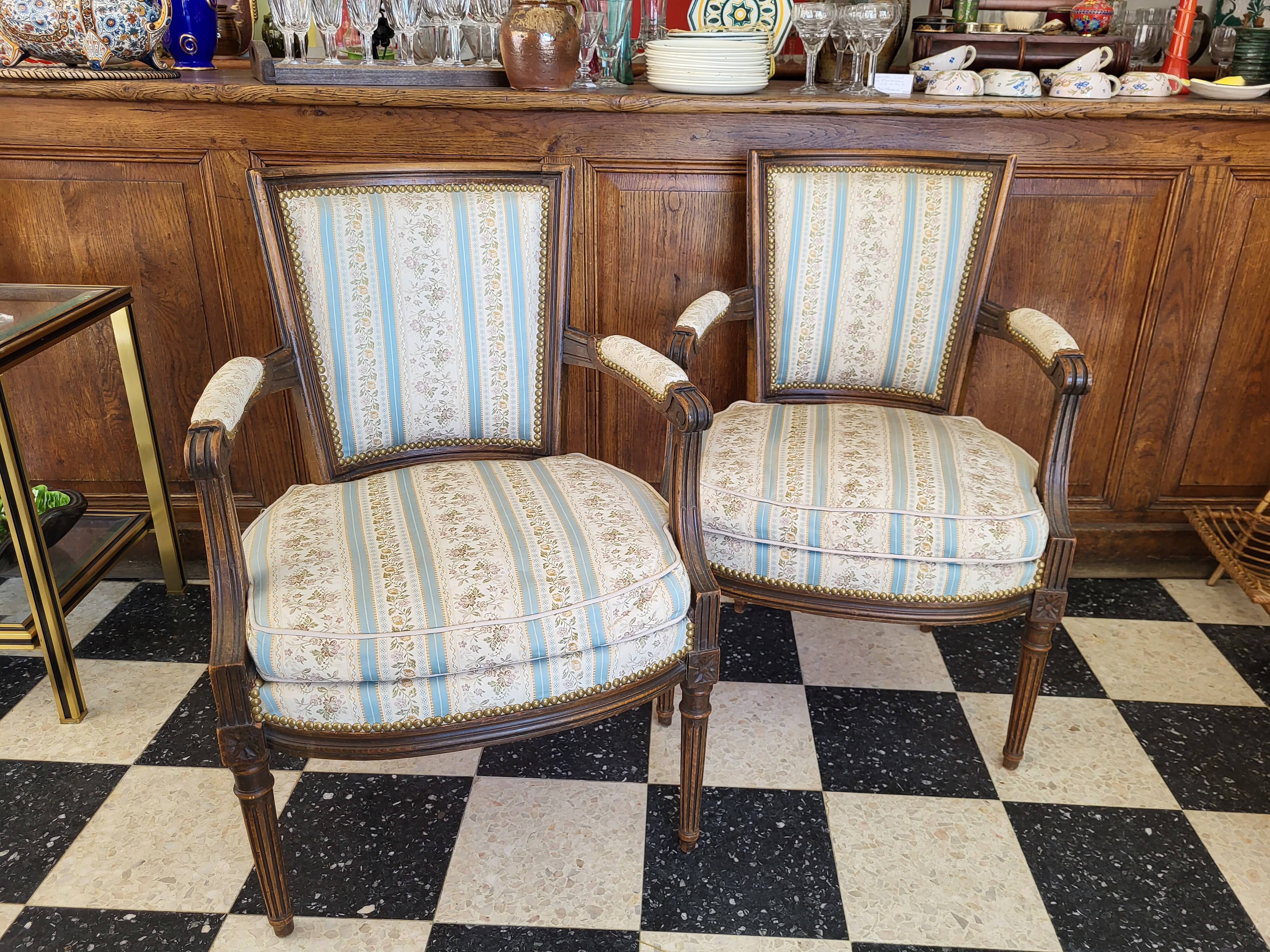 Pair of Louis XVI era convertible armchairs