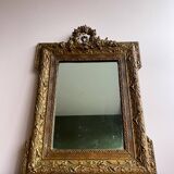 Golden trumeau mirror for fireplace, late 19th century, with sculpted pediment.