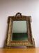 Golden trumeau mirror for fireplace, late 19th century, with carved pediment.