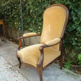 Old walnut Voltaire armchair