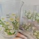 Orangeade service with a jug and six glasses featuring a daisy pattern.