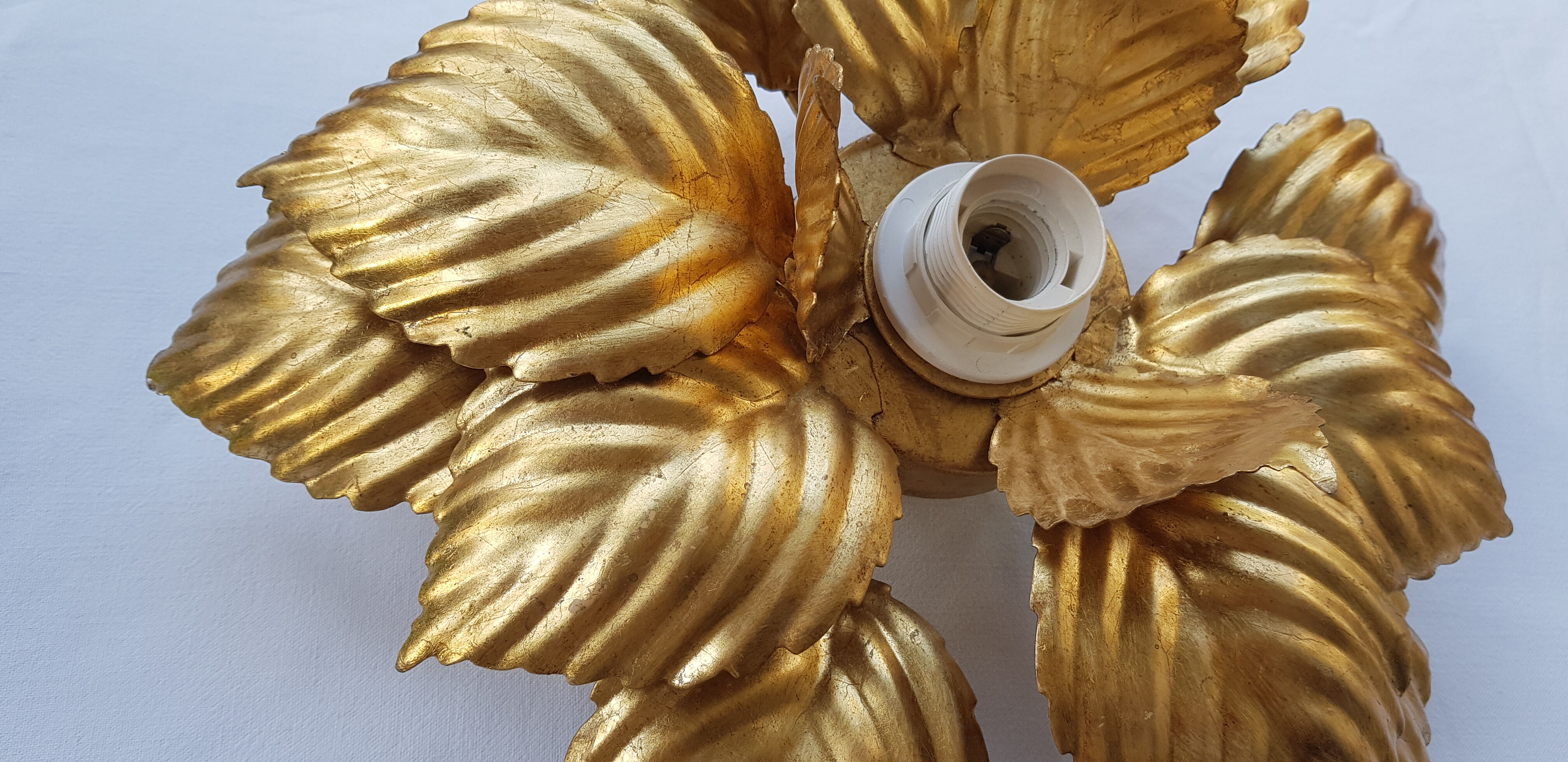 Golden metal flower sconce