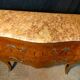 Louis XV style commode with marquetry and marble.