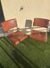 A pair of vintage brown Skaï chairs.