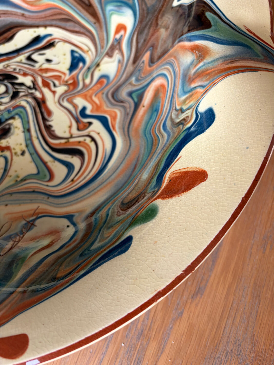 Glazed ceramic plate signed