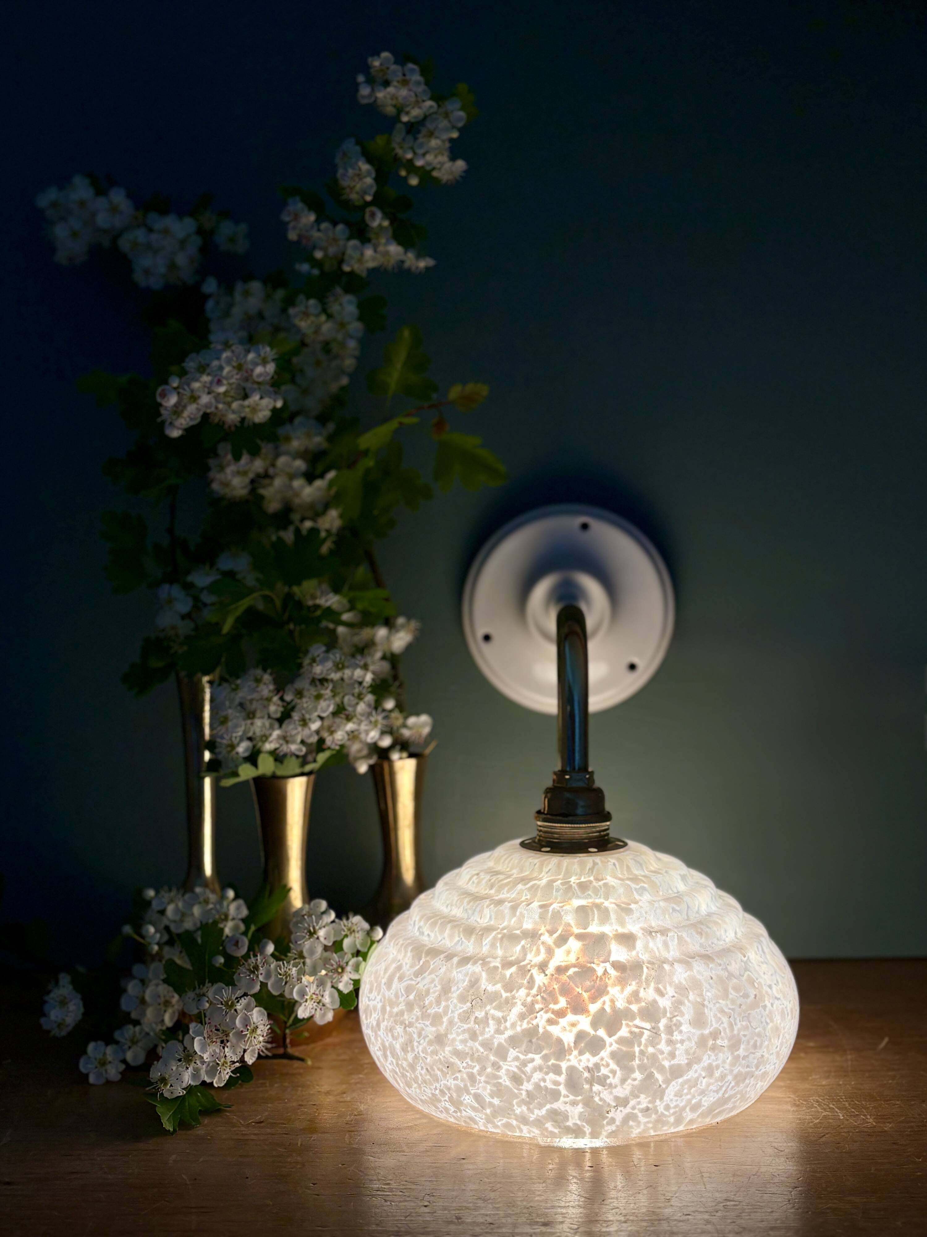 Vintage glass wall lamp with a white Clichy shade.
