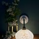 Vintage glass wall lamp with a white Clichy shade.