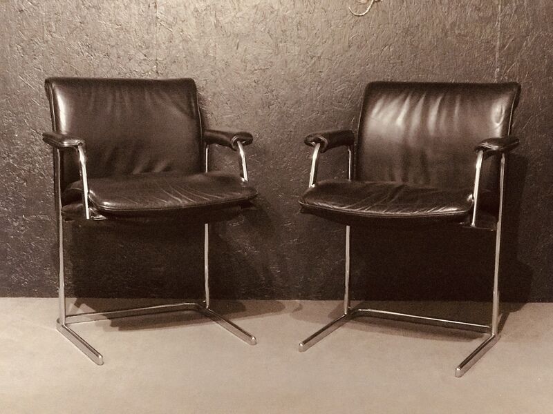 Pair of black leather Scandinavian armchairs