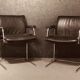 Pair of black leather Scandinavian armchairs
