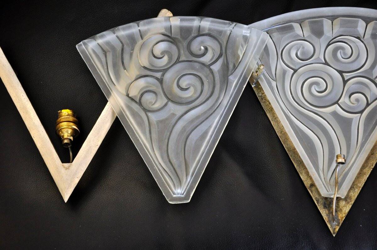 Pair of angular art deco wall sconces with silver metal frames