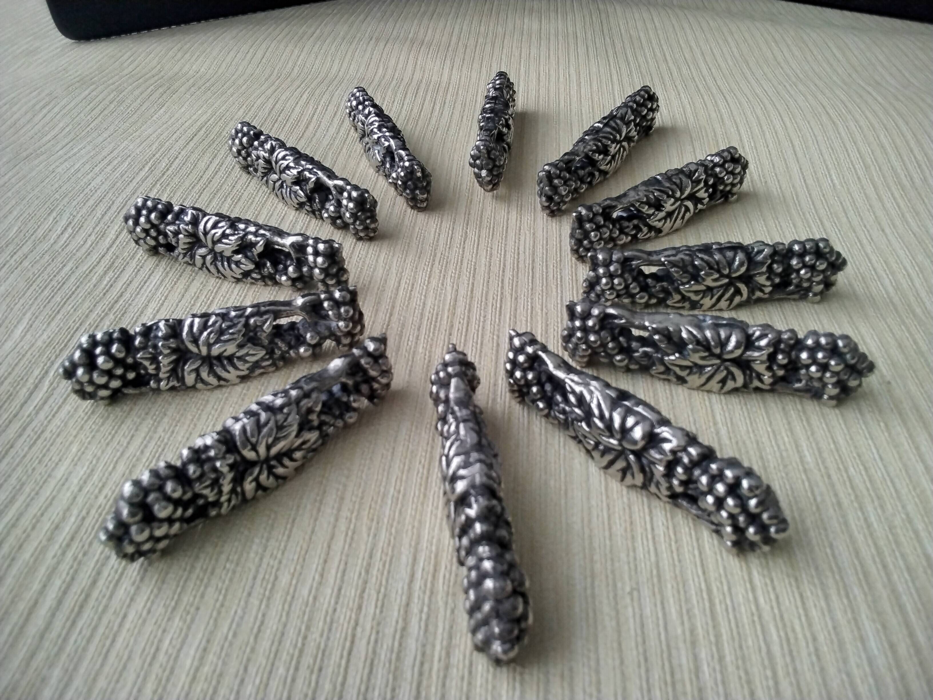 12 Metal knife holders with bunches of grapes and vine leaves