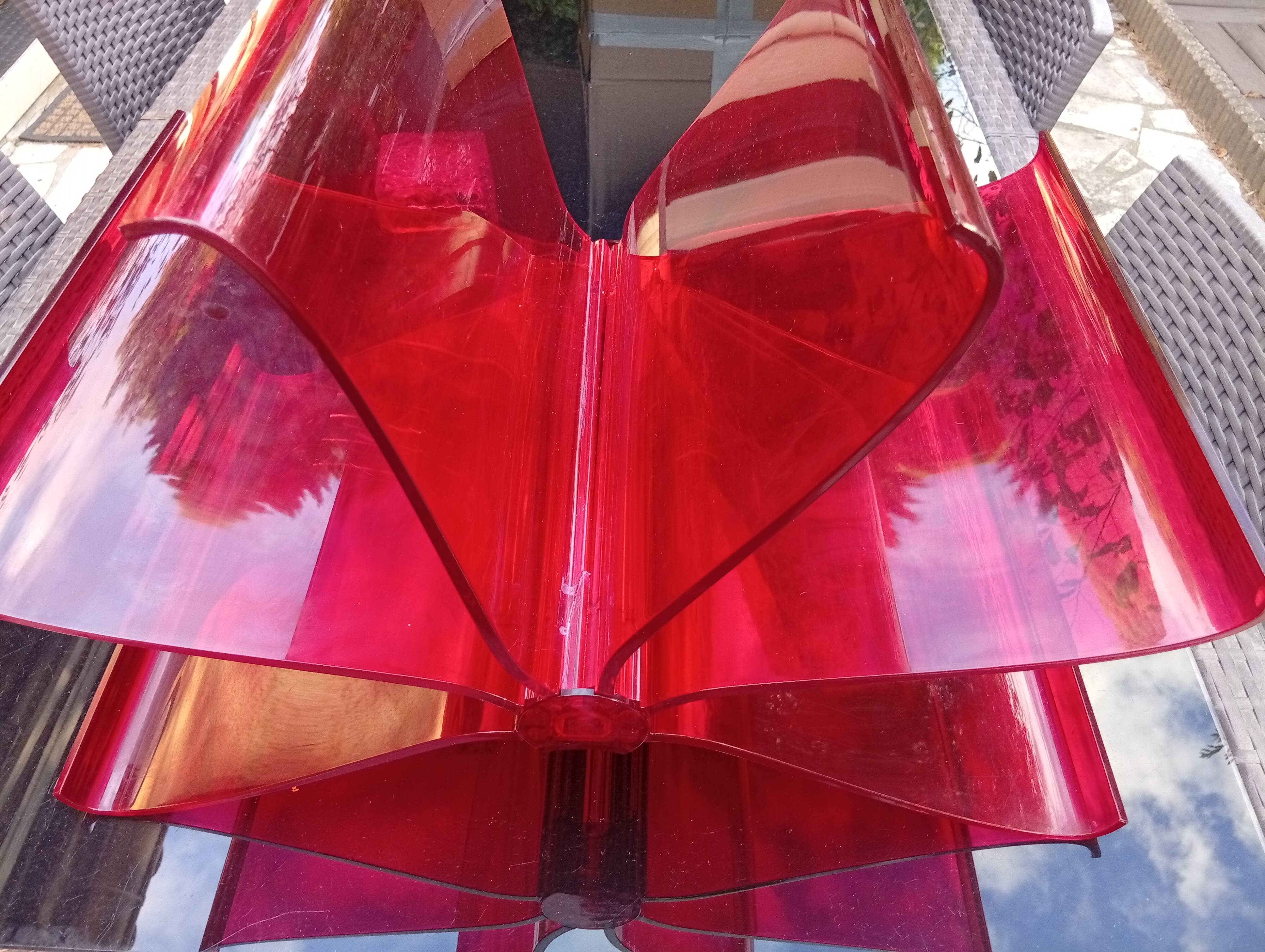 Kartell red magazine rack