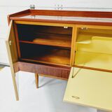 Vintage row in lacquered wood and formica