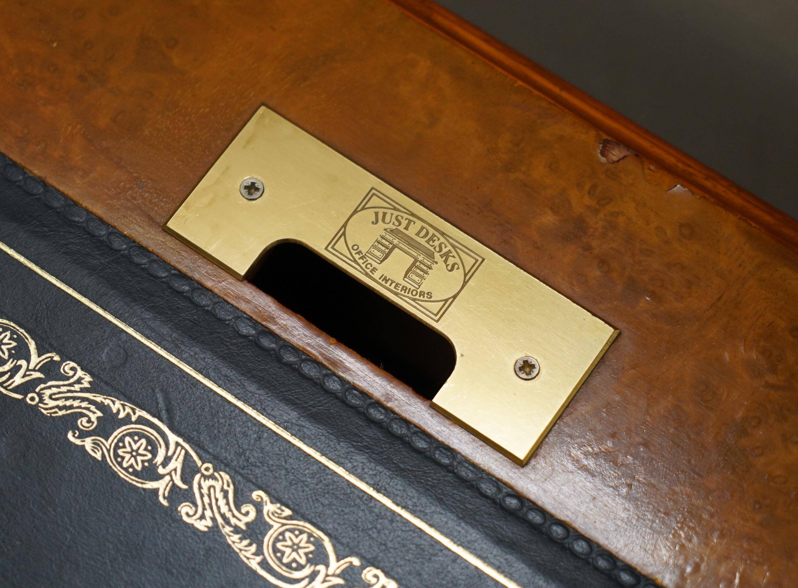 Partner desk in burr walnut designed to conceal computer equipment.