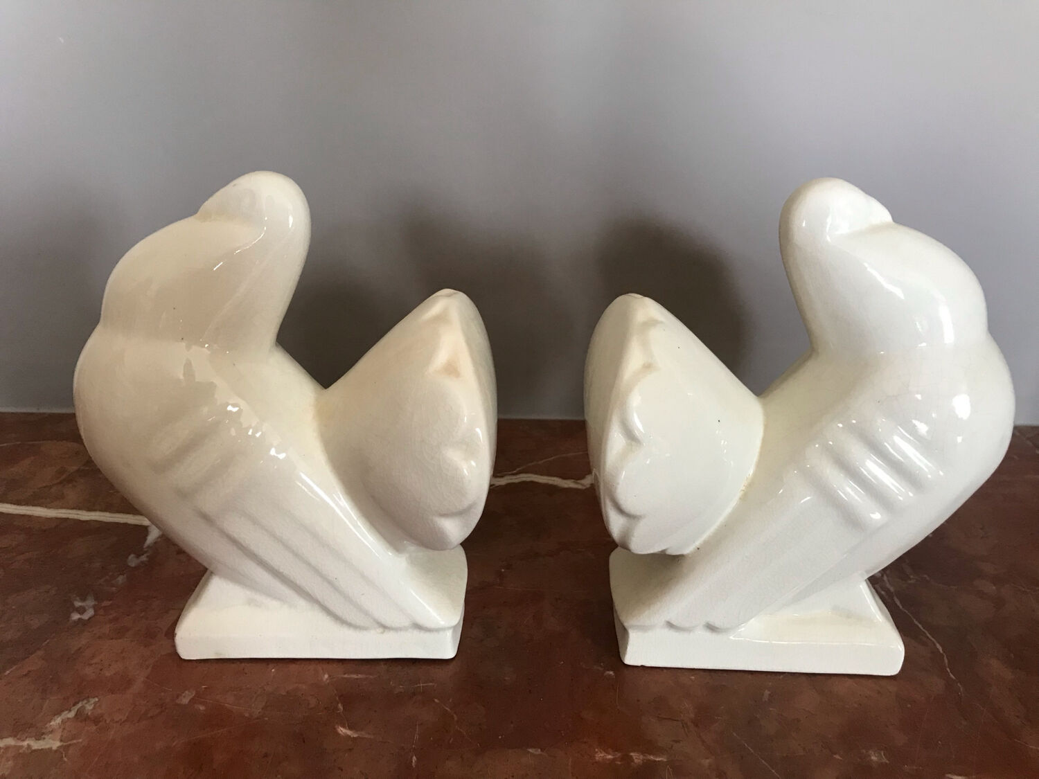 Pair of bookends in ceramic art deco cracked pigeons signed