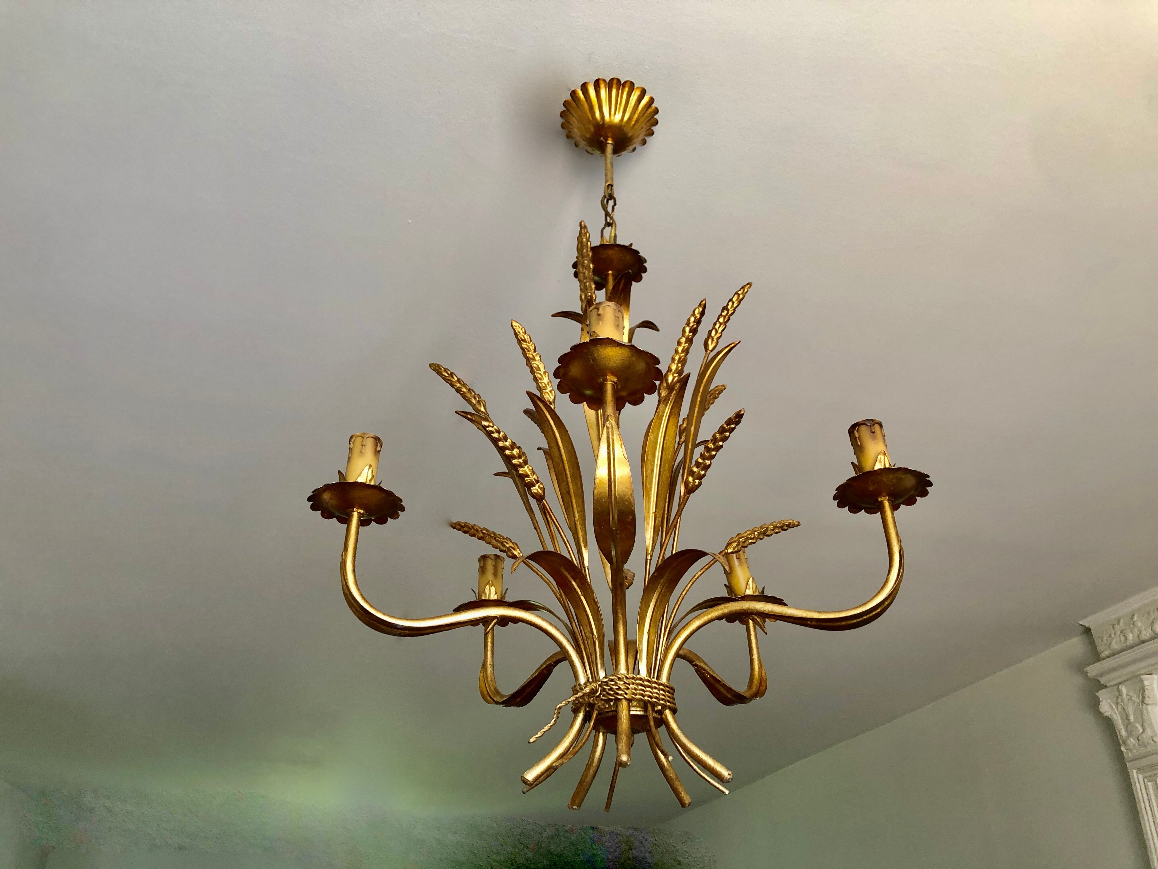 Golden suspension 5 fires with a bouquet of ears of wheat