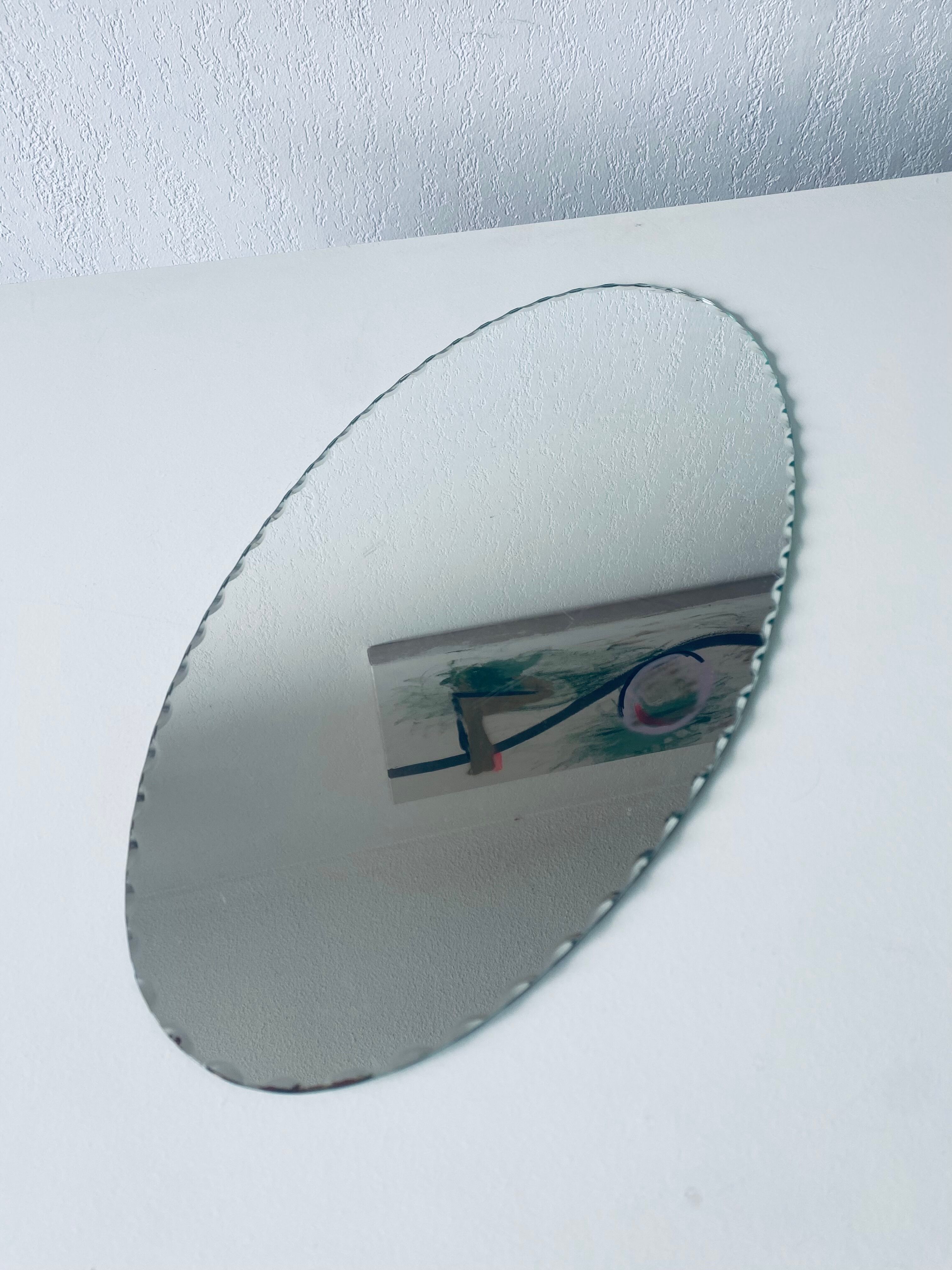 Oval beveled mirror 50x25cm