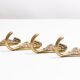 Set of four decorative vintage gold wall hooks, Europe, 1960s.