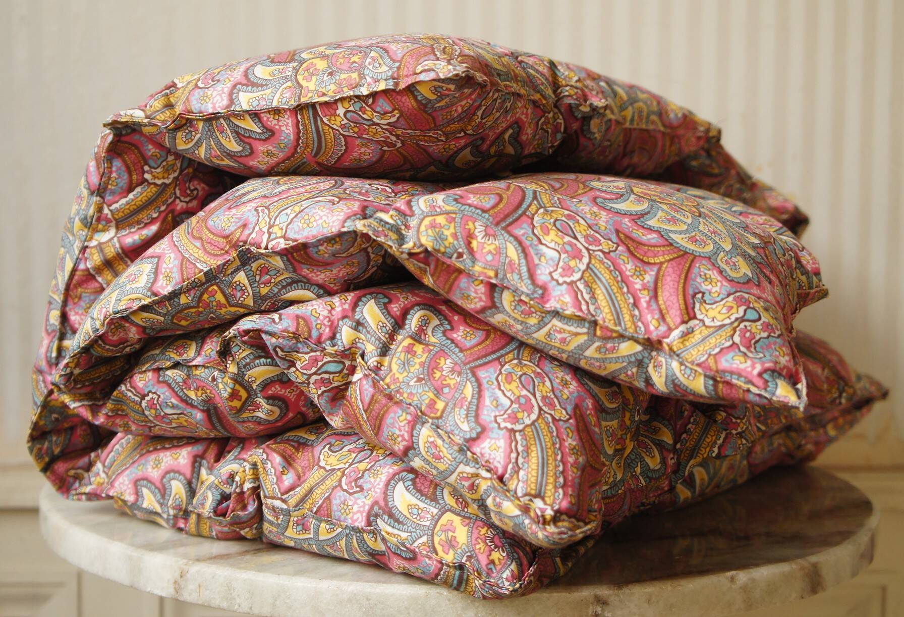 Small quilt filled with paisley pattern feathers