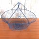Old foldable blue metal basket, vintage handles