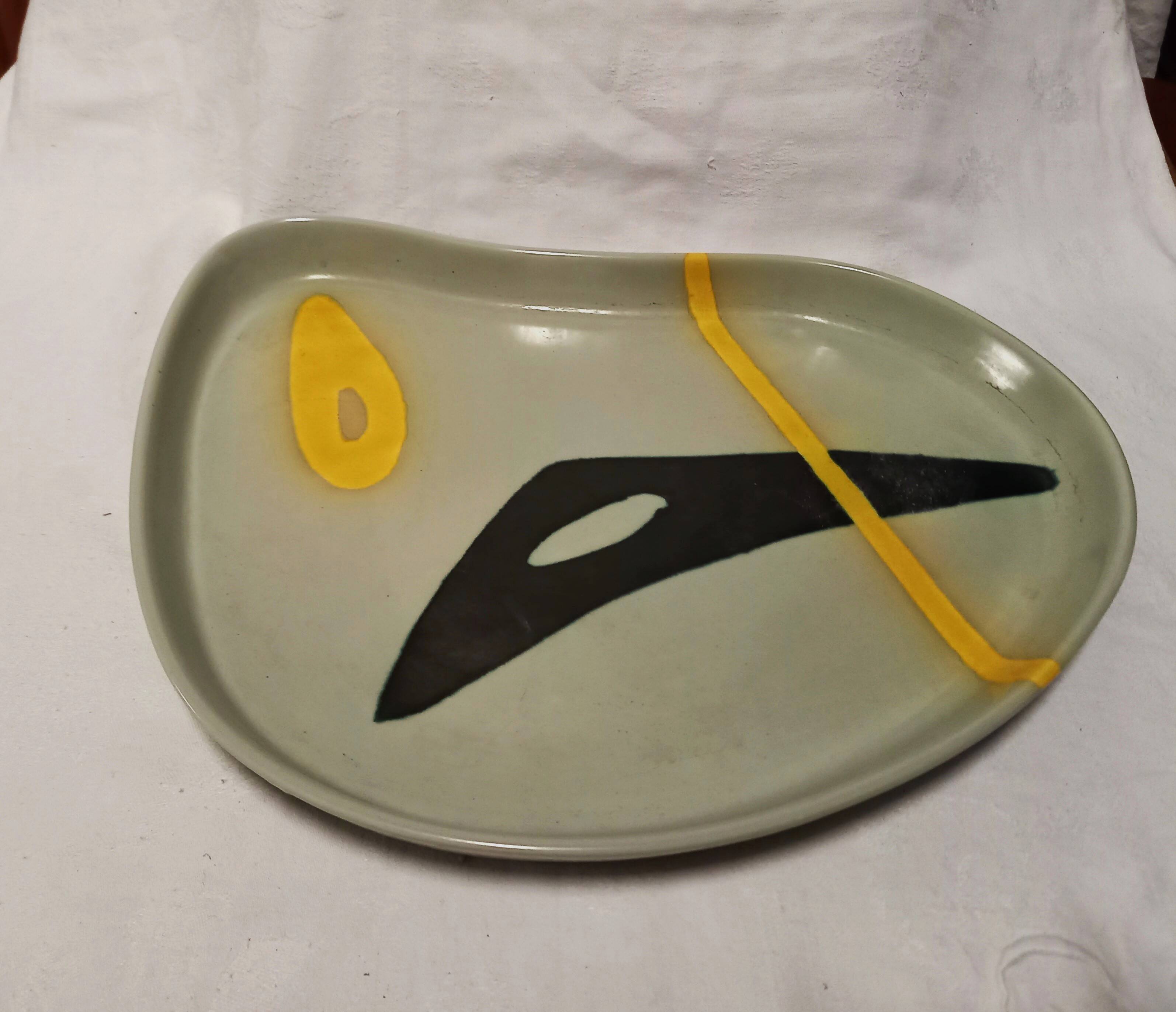 Ceramic dish by Peter Orlando, free form with abstract decoration, 1950s
