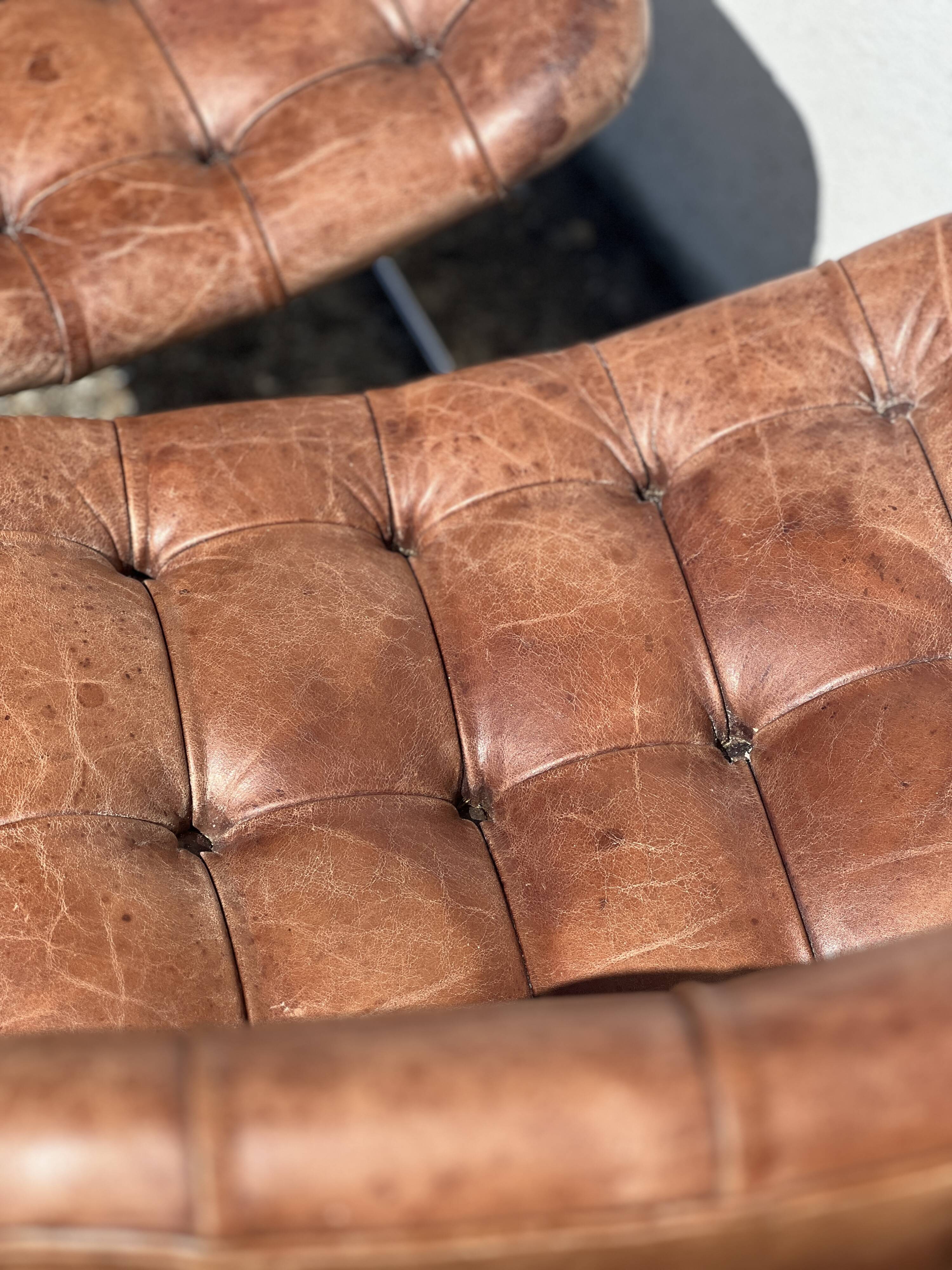 Pair of leather chairs by Robert Haussman