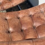 Pair of leather chairs by Robert Haussman