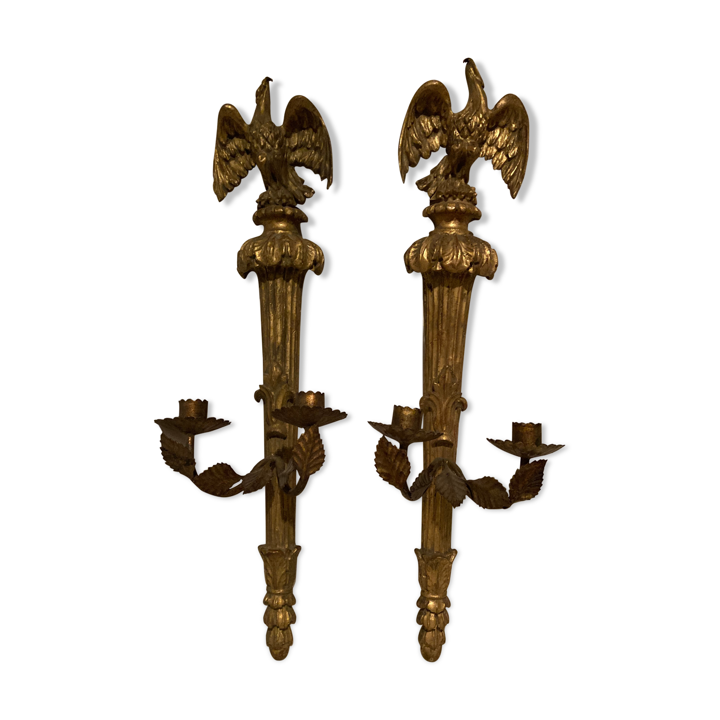 Pair of candle holders in wall, eagle pattern in gilded wood and brass