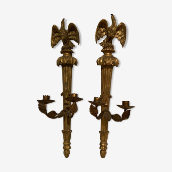 Pair of candle holders in wall, eagle pattern in gilded wood and brass