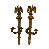 Pair of candle holders in wall, eagle pattern in gilded wood and brass