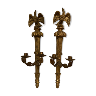 Pair of candle holders in wall, eagle pattern in gilded wood and brass
