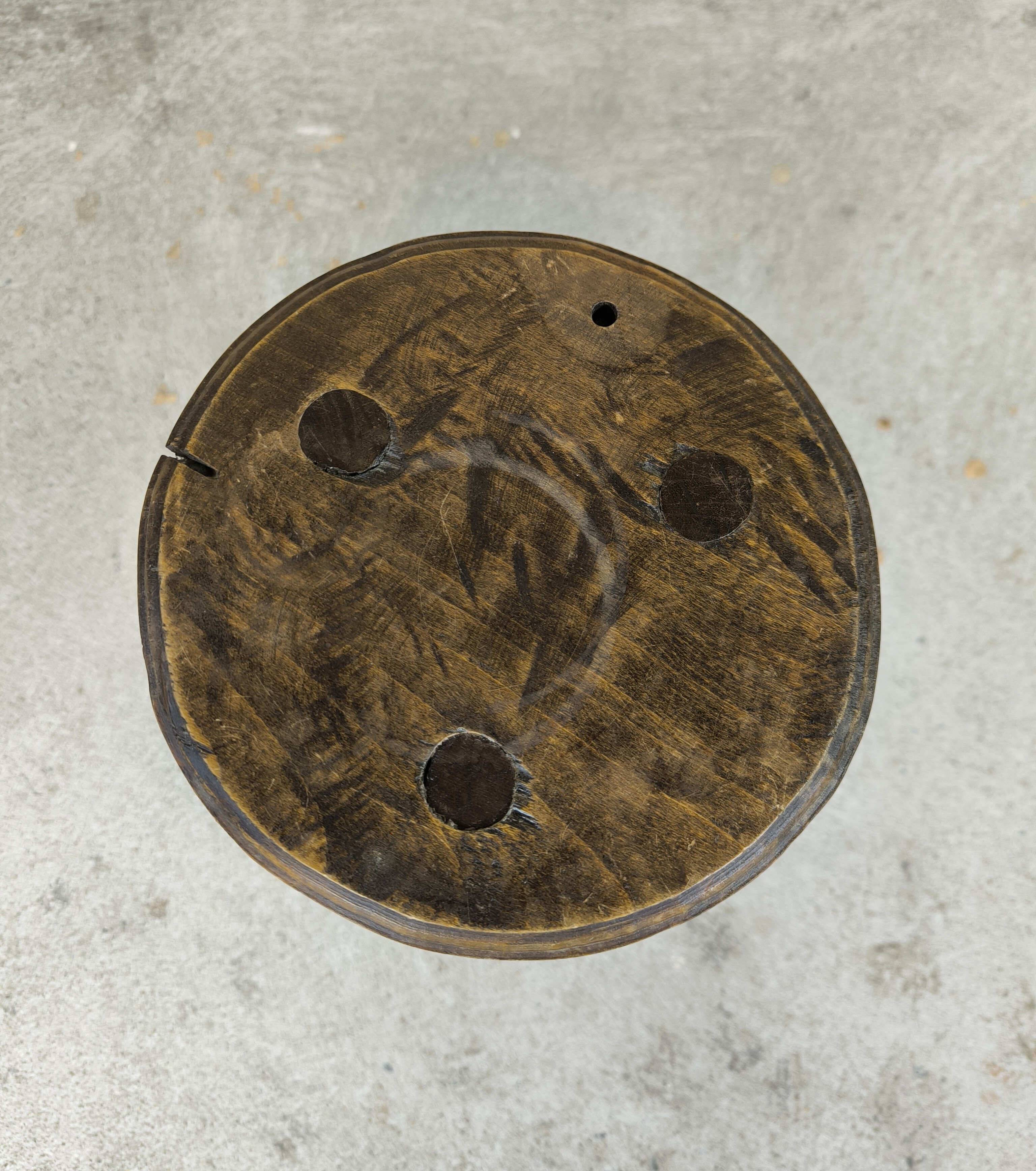 Vintage tripod plant stand with curved legs.