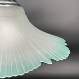 Frosted glass flower pendant with a water green edge.