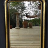 Louis Philippe mirror in blackened and gilded wood, 74 x 102 cm
