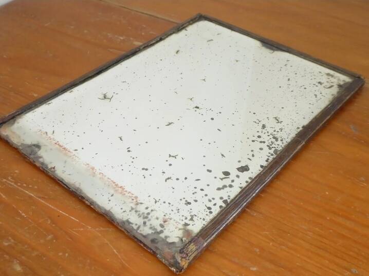 Table mirror on a brass easel